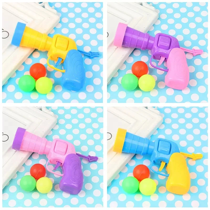 interactive cat pompom launcher, cat toy gun with pompoms, mini pompom shooter for cats, plush ball launcher for cats, interactive toys for kittens, cat playtime pompom gun, best interactive cat toys, pompom ball cat games, indoor cat exercise toys, cat fetch pompom gun, pompom launcher toy for pets, engaging cat toys, automatic pompom shooter, cat play gun with balls, creative cat toys for indoor play.